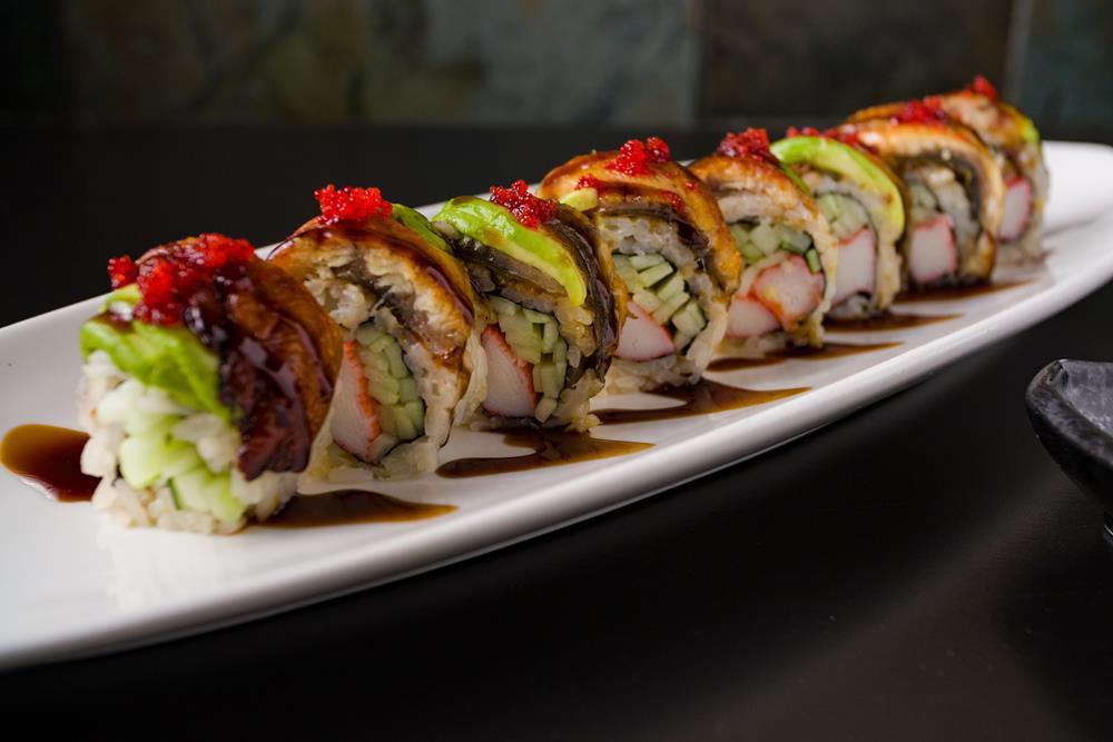 Dragon Roll · Crab and cucumber topped with eel, avocado and tobiko.