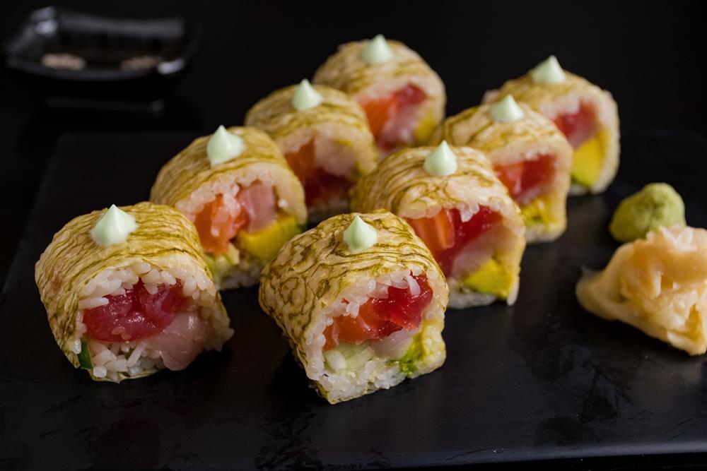 Gramercy Roll · Tuna, salmon, yellowtail, avocado, and cucumber with dashi nori and wasabi mayo.