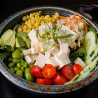 Vegan Tofu Poke Bowl · Tofu, avocado, edamame bean, cucumber, corn, tomato, creamy miso dressing.