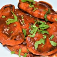 SWEET & SOUR EGGPLANT · Eggplant deep fried served w/ tamarind sauce