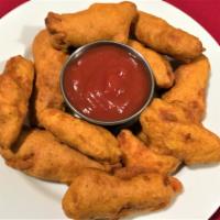 CHICKEN PAKORA · Marinated chicken deep fried and served with condiments.
