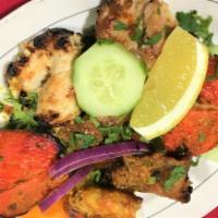 COMBINATION PLATTER (Appetizer) · Chicken tikka, malai kabab, boti kabab and shrimp cooked in clay oven.