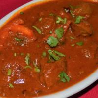 BEEF  VINDALOO  (Spicy) · Beef Cooked w/ Vinegar, red chilies, and spices make a very hot curry. Served with rice