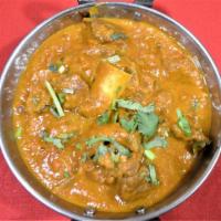 GOAT CURRY · Goat Cooked with onion and tomato Flavor sauce