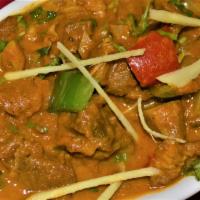 GOAT  KARAI · Goat tossed with onions, bell pepper, and fenugreek