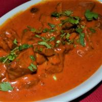 GOAT TIKKA MASALA · Goat Cooked w/ tomato, Cream sauce & Spices
