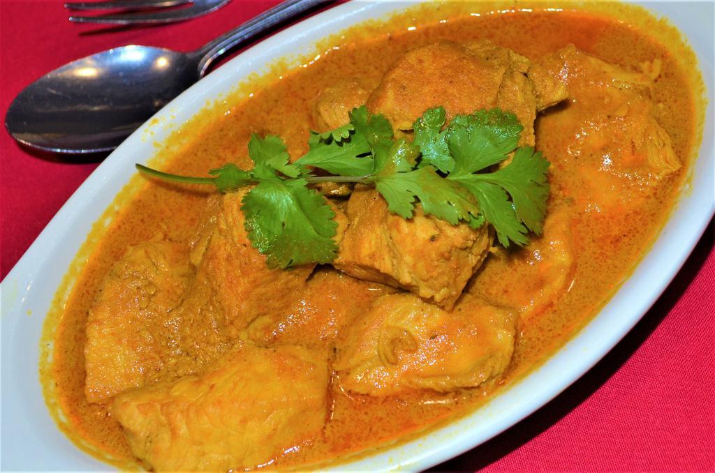CHICKEN CURRY · Chicken cooked with curry sauce. Served with rice.