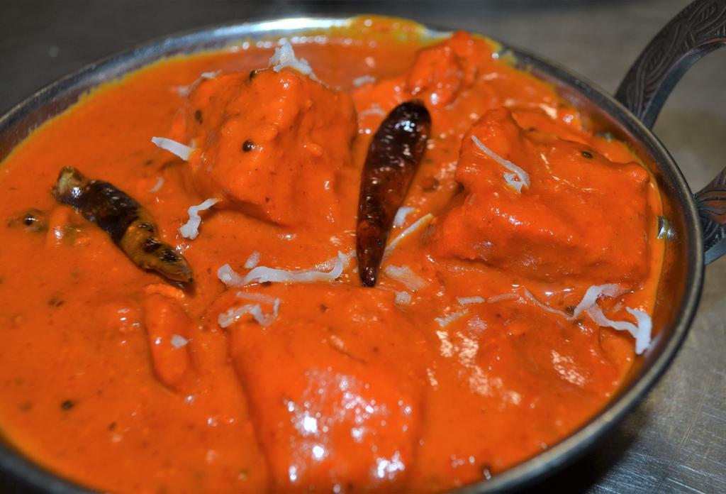 CHICKEN CHETTINAD · Chicken Cooked w/ coconut milk,curry leaves, black paper & mustard seeds.