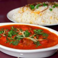 LAMB TIKKA MASALA · Lamb cooked with tomato and cream sauce. Served with rice.