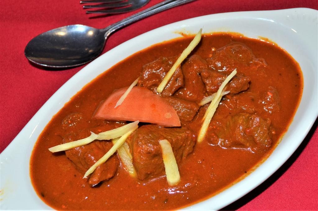 LAMB ROGAN JOSH · Succulent pieces of lamb in cardomum aniseed and paprika flavored sauce. Served with rice.