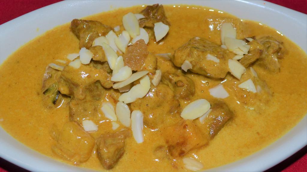 LAMB KORMA  (Mild) · Supremes in almond cream sauce. Served with rice.