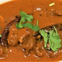 LAMB MADRAS  (Spicy) · cooked with dry red chilies, coconut, curry leaves & mustard seeds