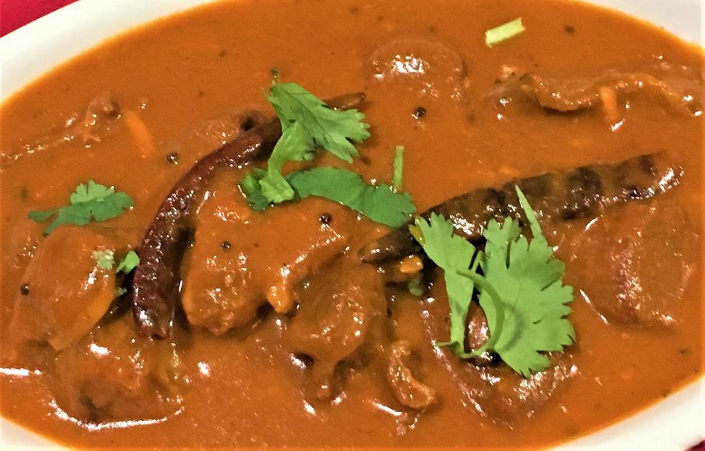 LAMB MADRAS  (Spicy) · cooked with dry red chilies, coconut, curry leaves & mustard seeds