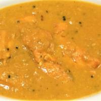 MALABAR SALMON CURRY · Salmon cooked in mustard sauce Served with rice.