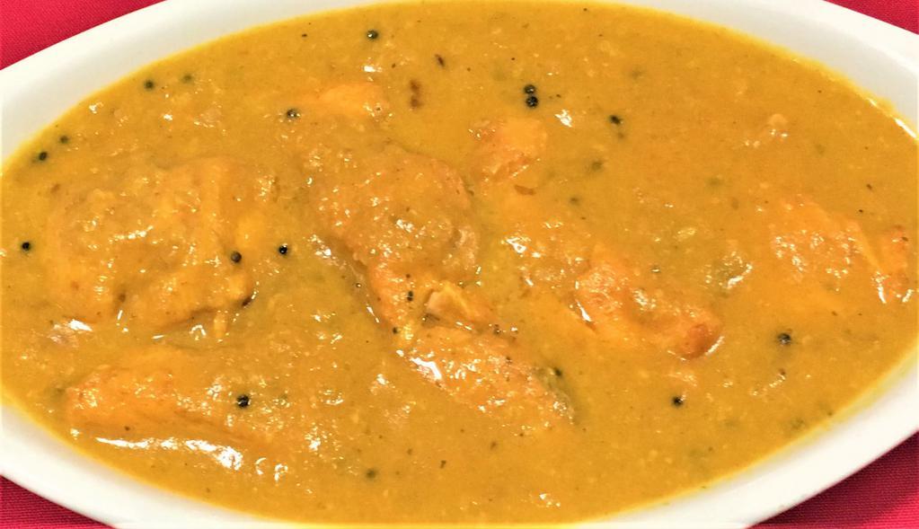 MALABAR SALMON CURRY · Salmon cooked in mustard sauce Served with rice.