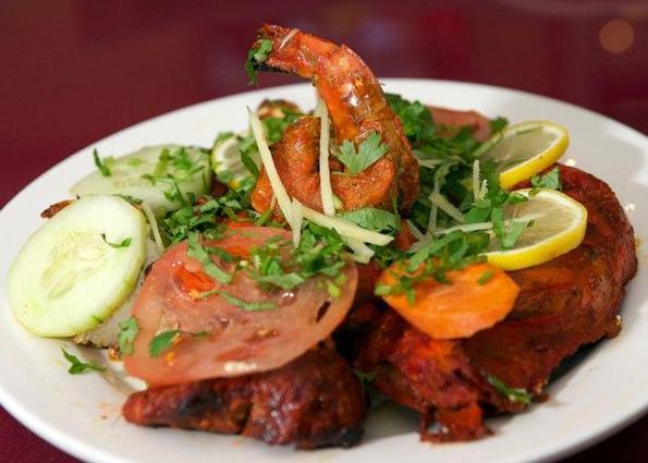 TANDOORI MIX GRILL · Assortment of lamb, chicken, and seafood cooked in clay oven. Served with rice.