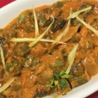 BHINDI MASALA · Fresh okra with tomatoes, onions and spices. Served with rice.