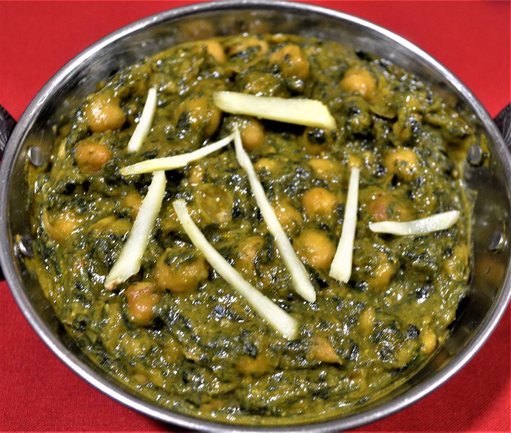 CHANA SHAAG · Chickpeas with spinach cooked with yellow sauces. Served with rice.