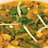 MIXED VEGETABL CURRY · Assorted vegetables cooked with tomato and onion sauce. Served with rice.