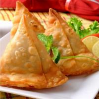 Vegetable Samosa · Potato and peas puff pastry served with fresh mint sauce.