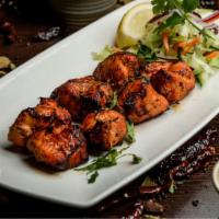 Chicken Tikka · Grilled boneless chicken tenders cooked in a traditional clay oven.