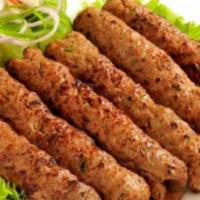 Chicken Reshmi Kebab · Minced chicken seekh kebab with herbs and spices cooked in the tandoor.