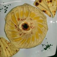 Hummus · Mashed garbanzo beans with tahini sauce, fresh lemon juice, olive oil and salt. Vegan and gl...