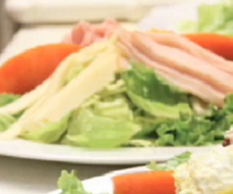 Chef Salad · Freshly cut lettuce, ham, turkey, Swiss and cheddar cheese, tomato, cucumber, onion, sliced egg and choice of dressing.