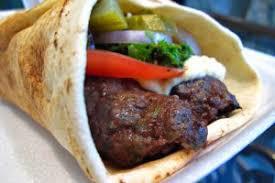 Kafta Kabab Sandwich · Charbroiled ground beef, lettuce, tomato, onion, cucumber, hummus spread, topped with tahini...
