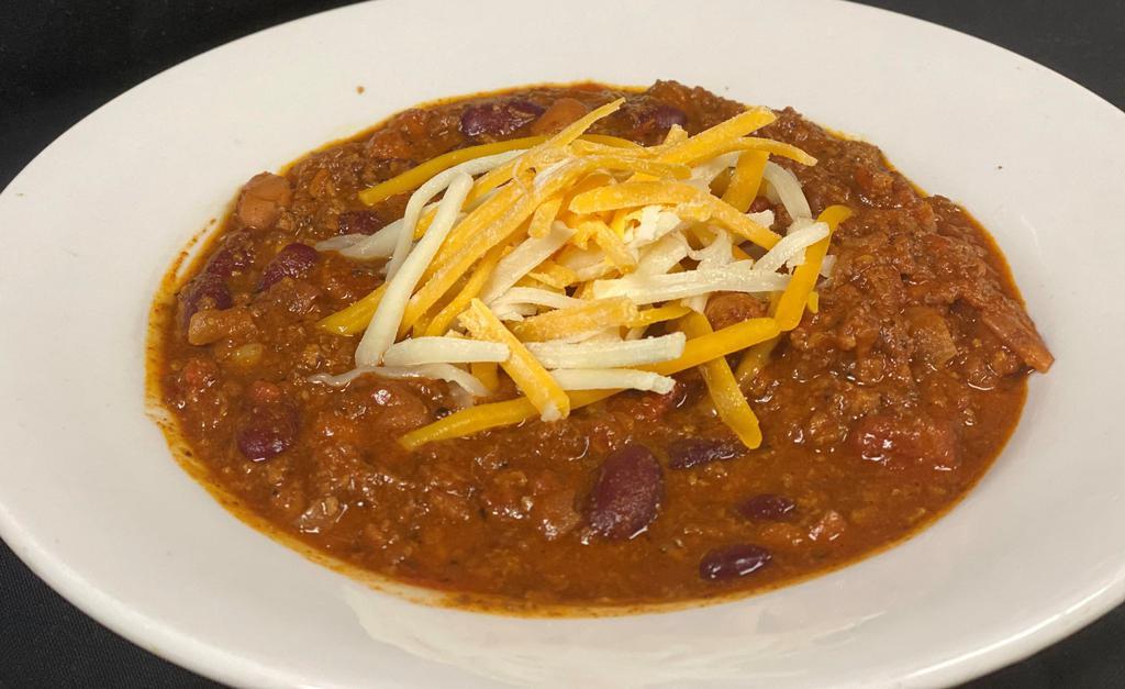 Chili · House made Chili with beef and beans topped with Jack & Cheddar Cheese. Served with Garlic Toast.