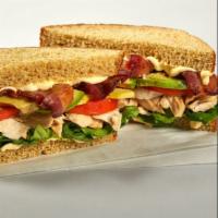 Neighborhood Chicken Club · Pulled chicken, bacon, house mayo, sliced tomato and little gem lettuce on whole wheat bread.