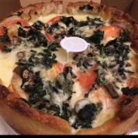 Spinach Dep Dish Pizza · Garlic base, basil, onions, mushrooms, tomatoes and mixed cheese.