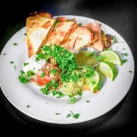 Quesadillas · Quesadillas in your choice of chicken, vegetarian, or vegan on flour or tortillas with guac ...