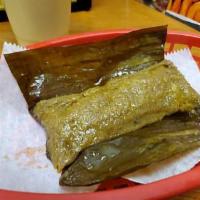 Pasteles de guineo · Pasteles en hoja is a plantain and root vegetables masa (dough) filled with meat and made in...