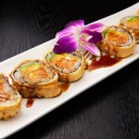 Volcano Roll · Kani, cucumber and avocado wrapped with avocado, and cooked spicy salmon.
