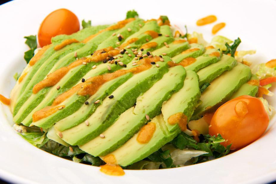 Avocado Green Salad · Avocado, iceberg lettuce, sherry tomatoes and cucumber with ginger dressing.