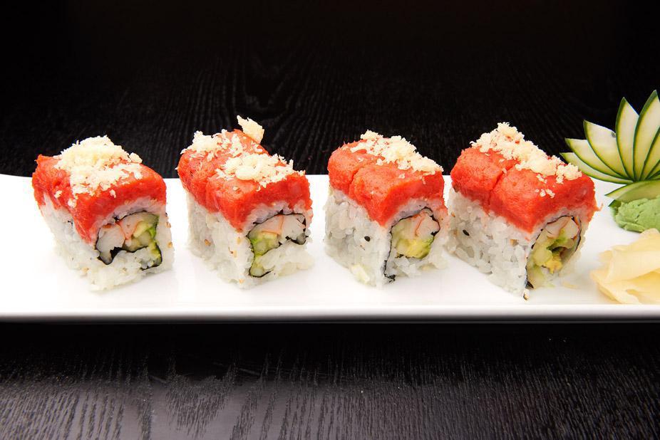 Red Dragon Roll · Kani, avocado and cucumber inside and spicy tuna with crunch on top. 