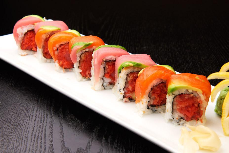 Dragon Roll · Spicy tuna and cucumber inside with tuna, salmon and avocado on top. 