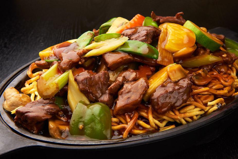 Sizzling Noodles with Vegetables · Pan-fried crispy noodles topped with assorted vegetables.