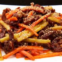 Beef a la Szechuan · Stir fried shredded beef, celery and carrots in succulent schezuan sauce.