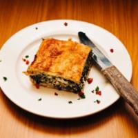 Spinach Pie · savory pastry dish with fresh spinach, Feta
cheese, scallions and herbs in phyllo dough