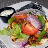Chicken Souvlaki Sandwich · cubed marinated chicken grilled until juicy and tender, served on toasted pita with lettuce,...