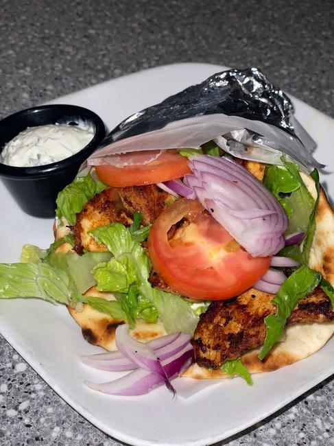 Chicken Souvlaki Sandwich · cubed marinated chicken grilled until juicy and tender, served on toasted pita with lettuce, tomatoes, onions, and tzatziki sauce