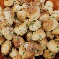 Garlic Knots · Marinated in extra virgin olive oil and minced garlic, topped with fresh Parmesan cheese. 3 ...