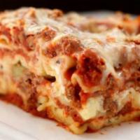 Lasagna · Home made lasagna stuffed with ricotta cheese, ground beef, mozzarella and Parmesan cheese.
