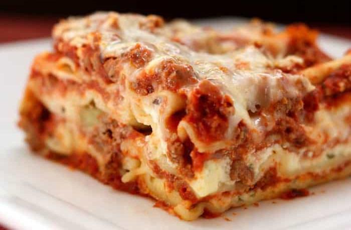 Lasagna · Home made lasagna stuffed with ricotta cheese, ground beef, mozzarella and Parmesan cheese.