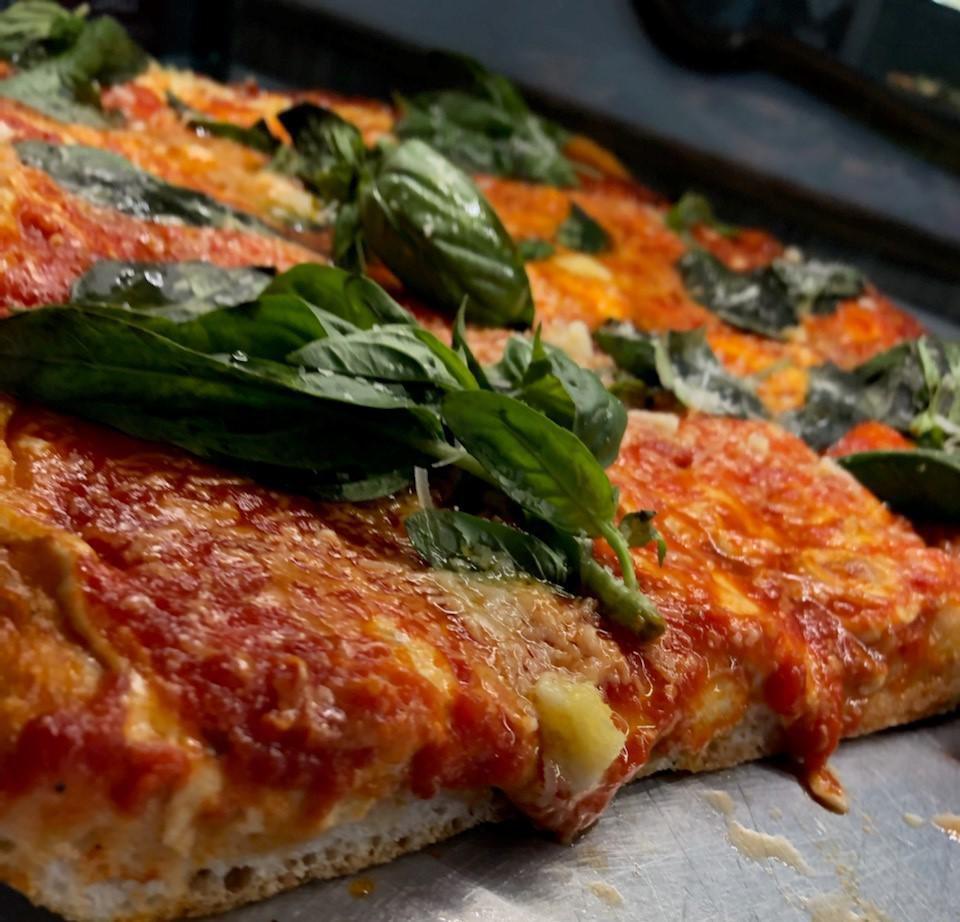 Nonna Slice · Grandma's old recipe. This deep dish delicacy is packed with savory marinara sauce, fresh mozzarella cheese, fresh basil and extra virgin olive oil, square slice.