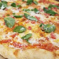 Margherita Pizza · Topped with Fresh Mozzarella, Basil, Cherry Tomatoes; Drizzled with Extra Virgin Olive Oil a...