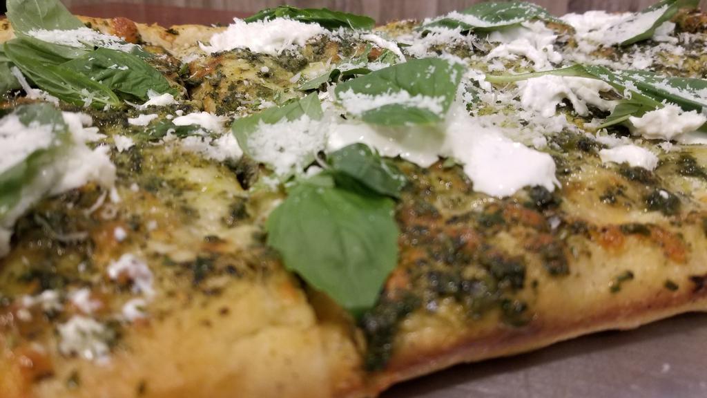 Pesto Burrata Slice · You can't go wrong with this founder's favorite. Made with Mozzarella Cheese, Homemade Basil Pesto; Dressed with Fresh Basil leaves, Parmesan Cheese, Olive Oil and topped with Le Pièce De Résistance... Fresh Burrata; Square.