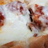 Meatball Parm Hero · A long sandwich on a roll. 